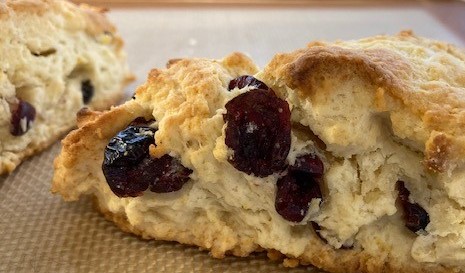 A close up of some biscuits with fruit on them