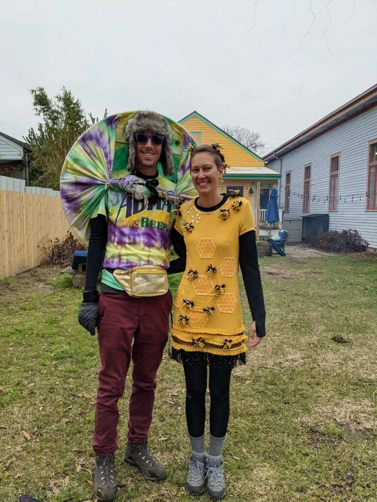 A man and woman dressed up in costumes.