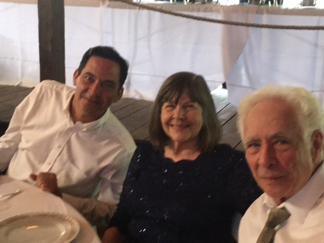 A group of people sitting around a table.