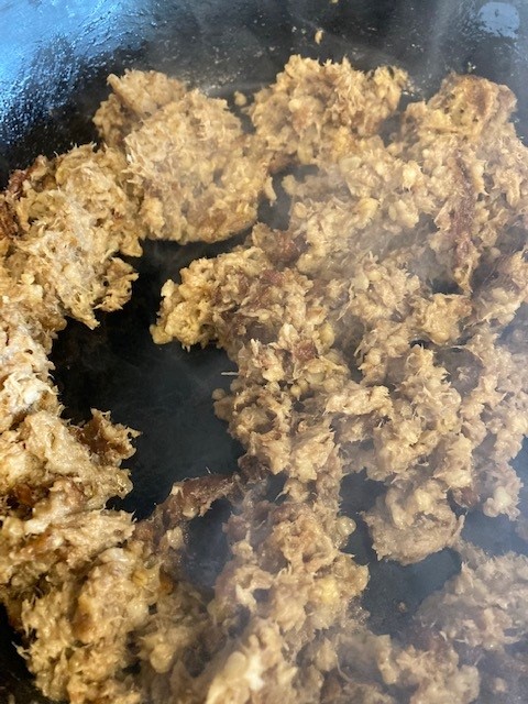 A close up of ground meat in a pan