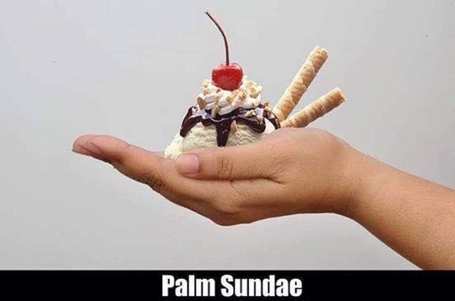 A person holding an ice cream sundae in their hand.