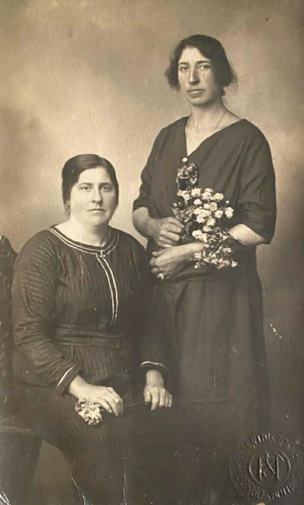 A woman and her mother pose for the camera.