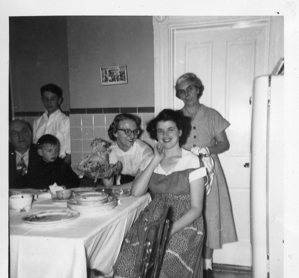 A group of people sitting around a table.